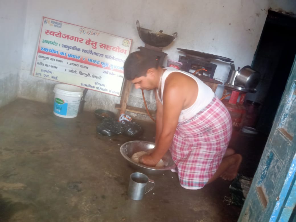 Ajay prepares food before opening his stall