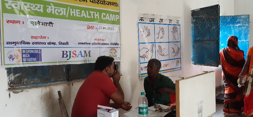 Budhan has his eyes examined at the camp